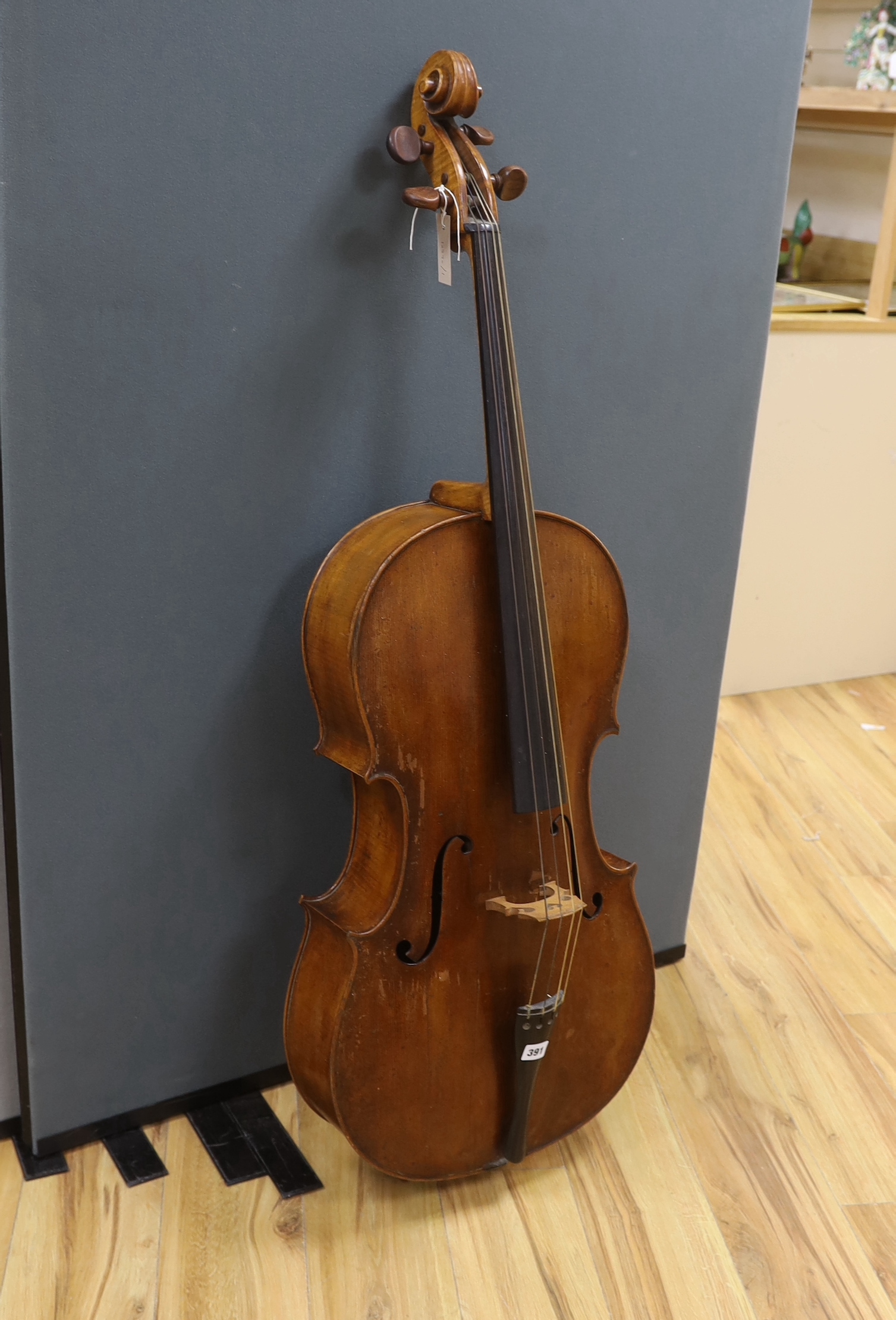 An early 20th century cello, back measures 76cm